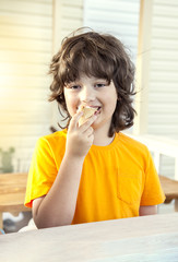 happy little boy eating an ice cream
