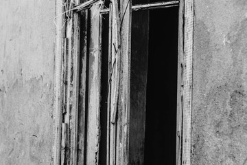The old window of an old abandoned house