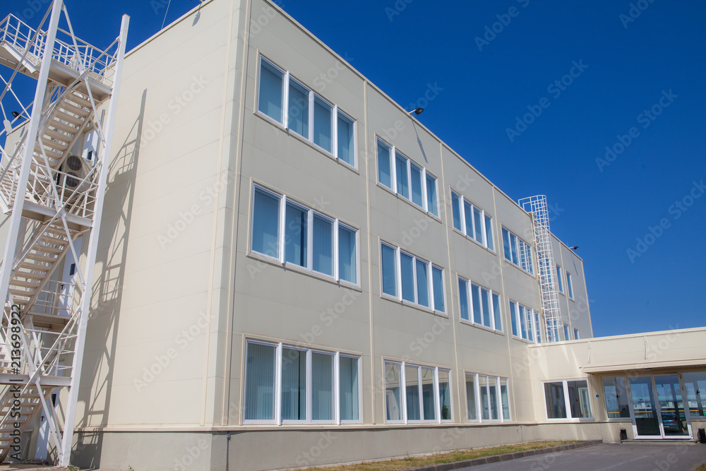 Wall mural modern three-story office building with a fire escape