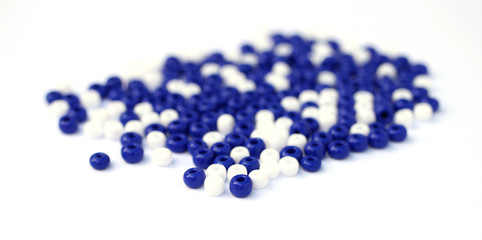 Mosaic from beads. White and blue beads. 