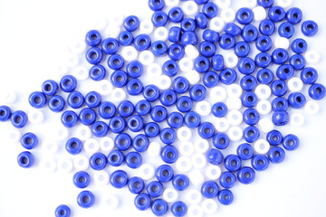 Abstract motive made out of blue-and-white beads. Composition. 