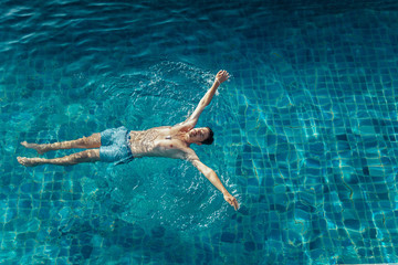 High angle view of man swimming in pool at resort