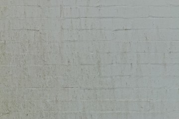Whitewashed stained brick wall