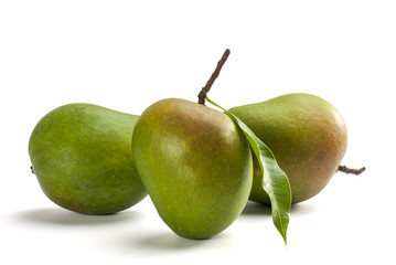 Mangoes with stem and leaf isolated on white background
