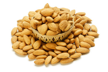 Almonds in Cane basket isolated on white background