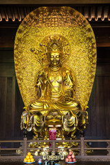 Golden Quan Yin Bodhisattva statue in Jade Buddha Temple, Shanghai China.