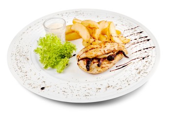 Grilled steak, French fries and vegetables