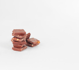 slices of original milk chocolate .isolated on white
