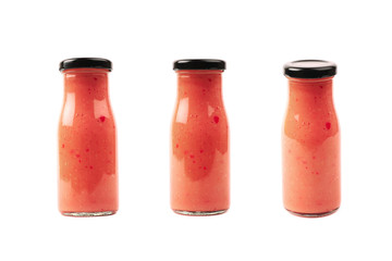 Red sauce in a glass bottle isolated