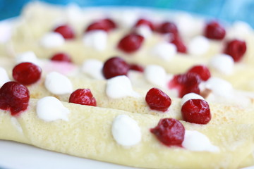 Pacakes with cherry berries background