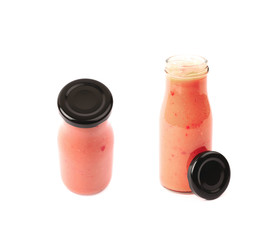 Red sauce in a glass bottle isolated