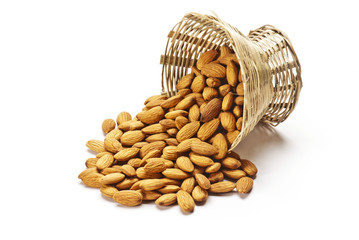 Almonds in Cane basket isolated on white background
