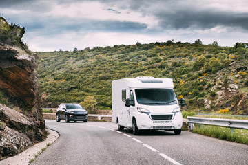 Motorhome Car Goes On Road On Background Of Spanish Mountain Nature
