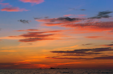 Fototapeta na wymiar Sunrise in the waves of the sea. Sunset on the sea.