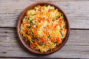 Asian noodles salad in bowl