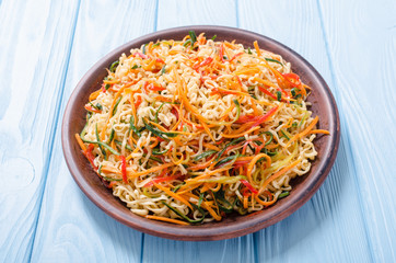 Asian noodles salad in bowl