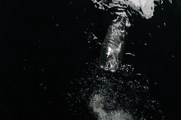 top view of plastic bottle in water, ecology protection concept