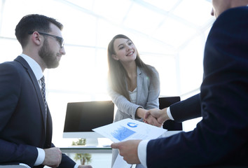 business woman and investor with a handshake.