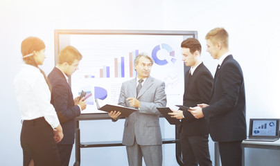 Manager discusses the financial presentation with business team