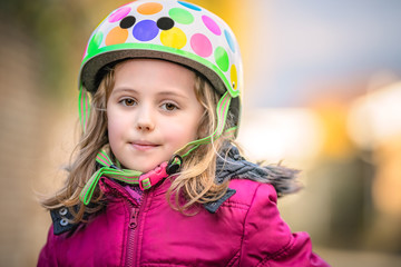 Young girl wearing cycle helmet