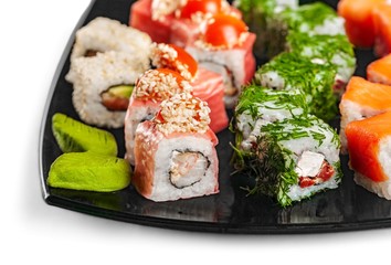 Maki-sushi on black plate