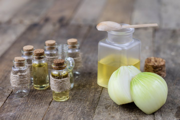 Onion juice and vegetables on a wooden table. Home-made syrup for the treatment of influenza.