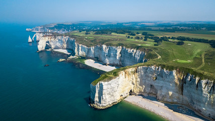 Drone view of seashore cliffs in Etretat France with a golf course