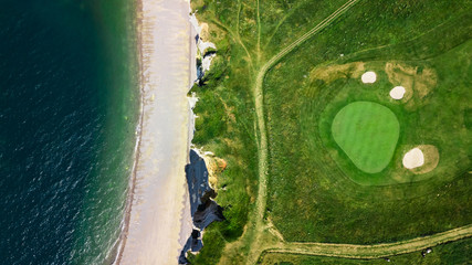 Drone view of a golf field next to the ocean in Etretat France