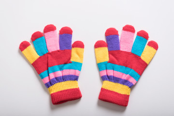 colorful baby glove on white background