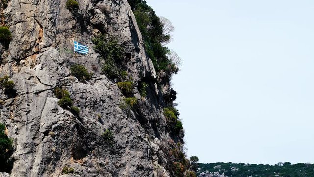 Greek flag on rock in Taygetus mountains Greece Peloponnese, Europe  time lapse 4K