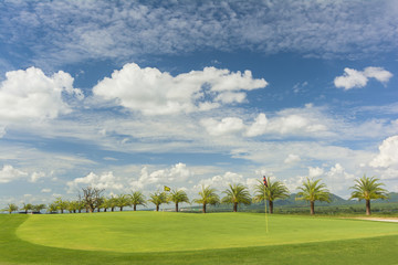 Golf course with a rich green turf beautiful scenery.