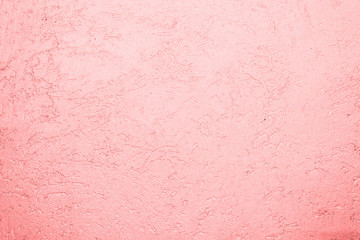 texture of the surface of the wall covered with decorative plaster of the woodworm type
