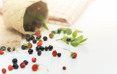 Forest berries on the table. Blueberries and strawberries.