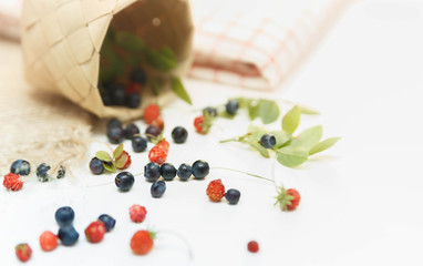 Forest berries on the table. Blueberries and strawberries.