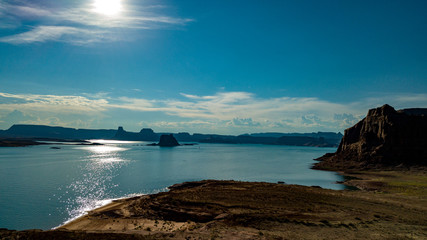 Aerial view of Lake Powell near Navajo Moutain, San Juan River in Glen Canyon with clear, beautiful skies, buttes, hills and water