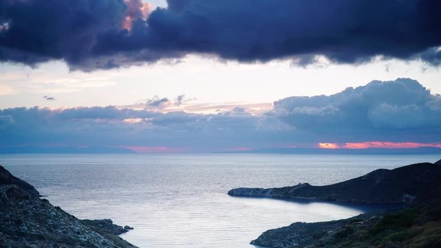 Clouds moving across sky over sea greek coastline at early morning, Greece Peloponnese Mani. Time lapse 4K