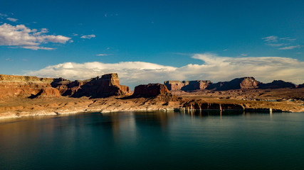 Aerial view of Lake Powell near Navajo Moutain, San Juan River in Glen Canyon with clear, beautiful skies, buttes, hills and water