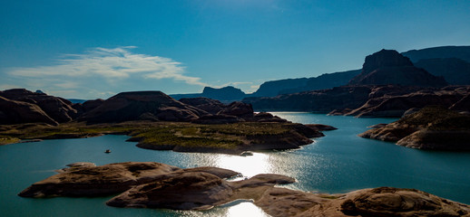 Aerial view of Lake Powell near Navajo Moutain, San Juan River in Glen Canyon with clear, beautiful skies, buttes, hills and water