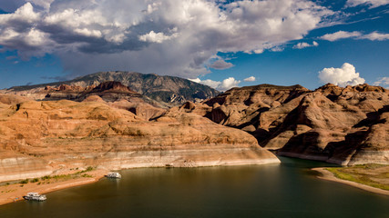 Fototapeta na wymiar Aerial view of Lake Powell near Navajo Moutain, San Juan River in Glen Canyon with clear, beautiful skies, buttes, hills and water