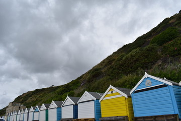 Fototapeta na wymiar Bournemouth beach huts on the seafront, England, June, 2018