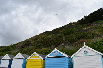 Fototapeta na wymiar Beach huts on the Bournemouth beach promenade, England, June, 2018