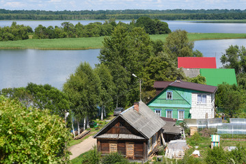 Village houses on the shore of the lake. Pskov region. The city of Sebezh.