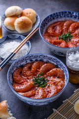 Prawns in spicy tomato sauce with rice, close view, asian cuisine