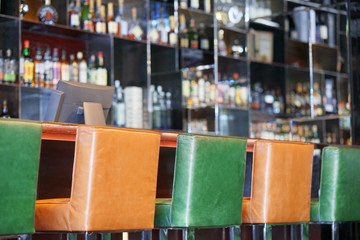 Side view of a bar hotel. Dance club interior. Nobody. Modern and beautiful bar in a night club. Bar counter in restaurant interior, of a bar in the hotel.