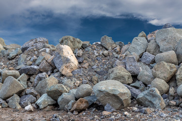 A large granite pile under the sky.