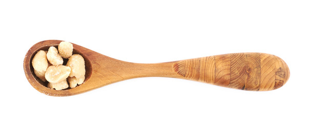Spoon of salted peanuts isolated