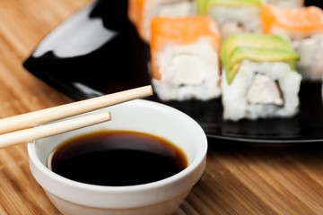 Maki-sushi on black plate