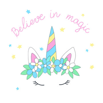 Cartoon head of the unicorn with flower wreath and inscription Believe in magic. Vector illustration, suitable for greeting card, poster or print on clothes.