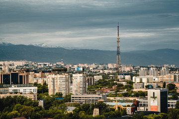 Fototapeta premium Almaty City landscape with kok tobe snow-capped Tian Shan mountains in Almaty Kazakhstan