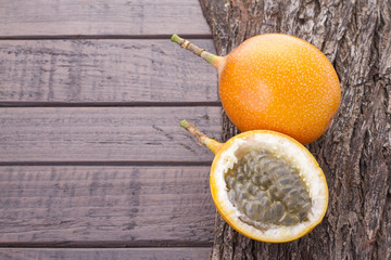 Passion fruit granadilla on the table - Passiflora ligularis